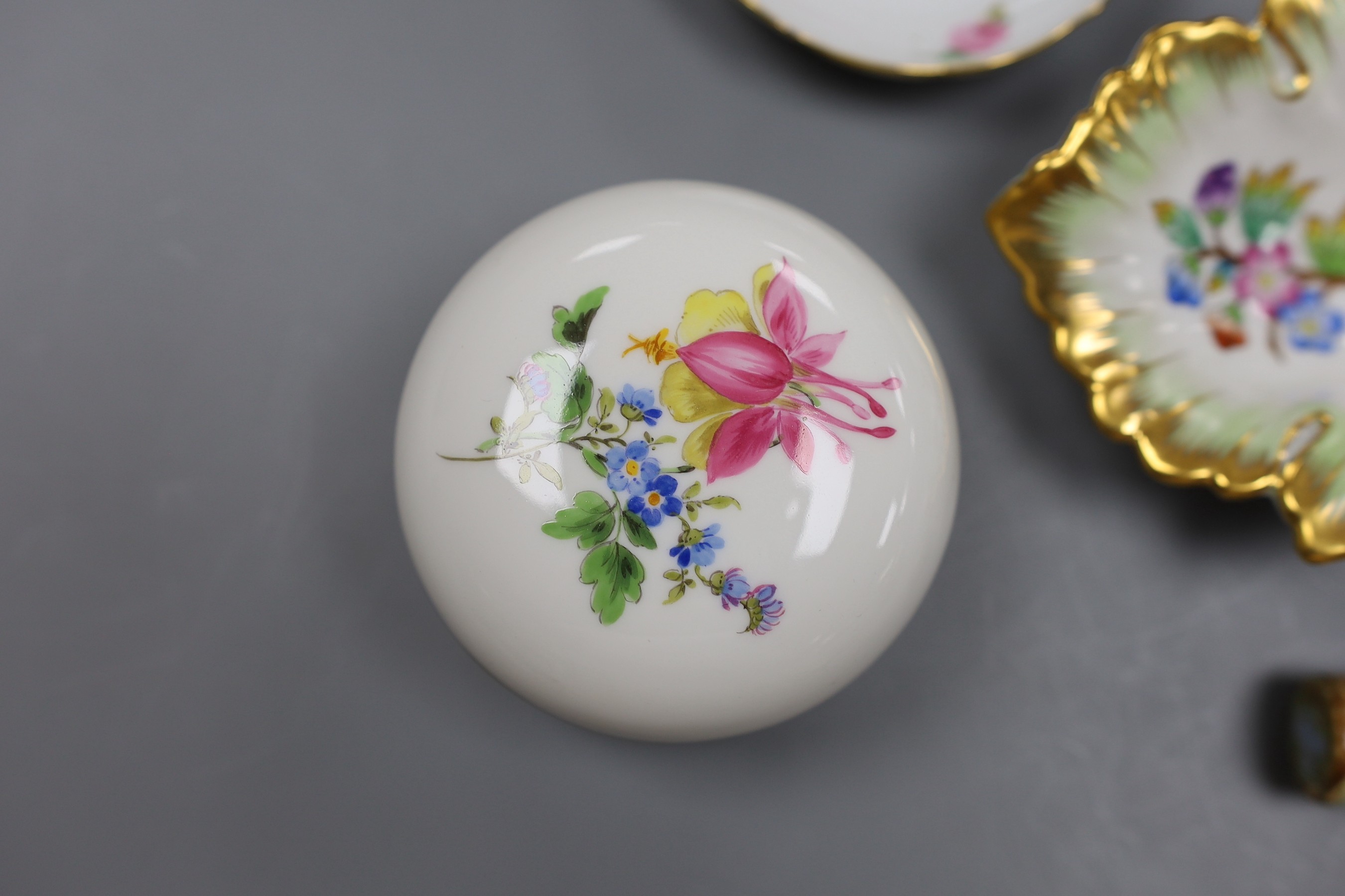 Two Meissen boxes with covers and a dish, two Herend dishes and an enamel on copper scent bottle